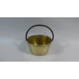 A Small Brass Jam Pan with Iron Loop Handle, 17cm Diameter