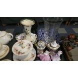 A Tray of Ceramics and Glassware to Include Figural Ornaments, Continental Vases, Cake Stand, Etched