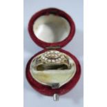 A 15ct Gold Mourning Ring with Braided Hair and Seed Pearl Mounts, 3.1g
