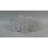 A Collection of Four Etched and Cut Glass Dressing Table Pots