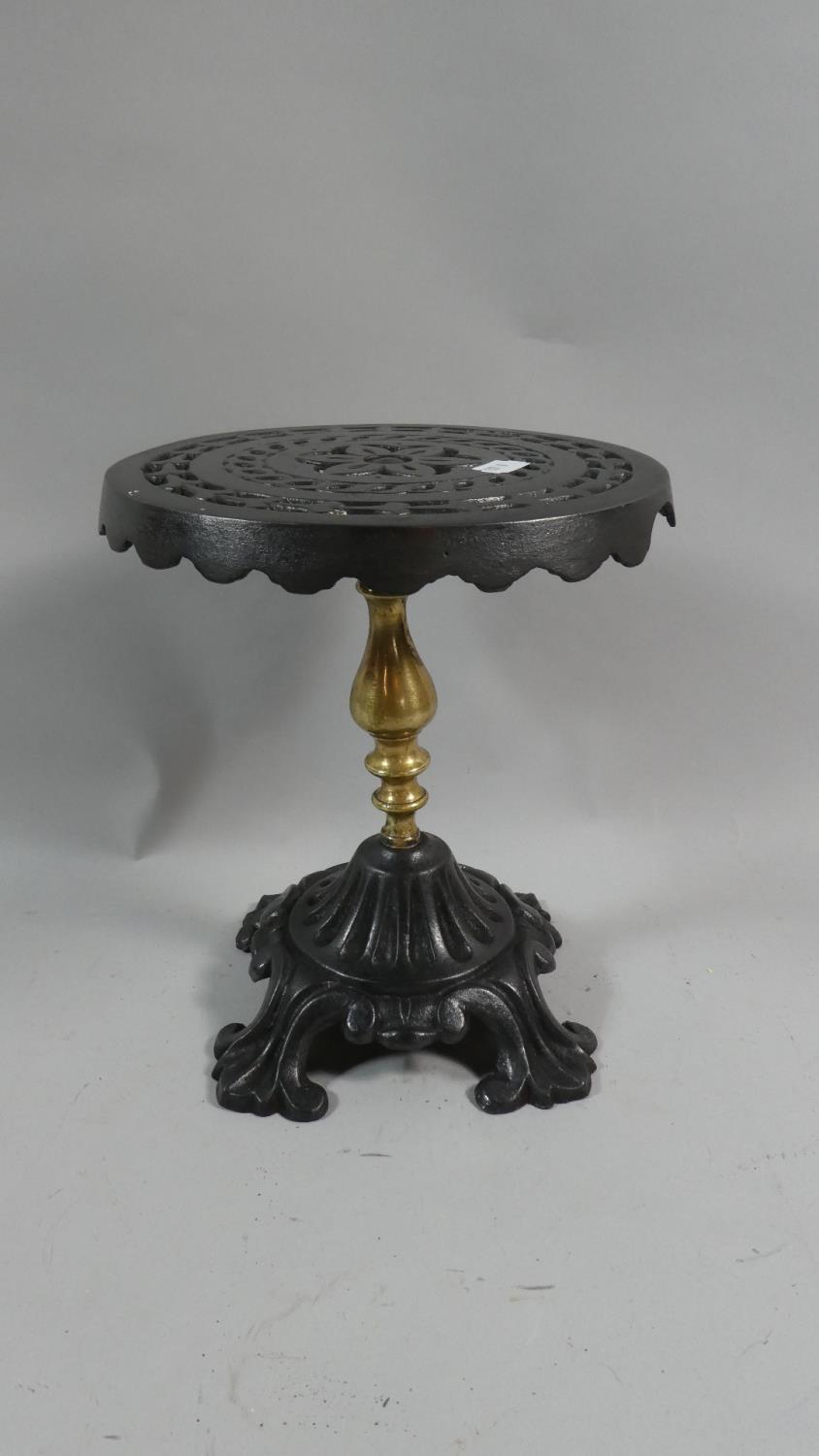 A Victorian Brass and Iron Circular Topped Kettle Stand, 22cm Diameter