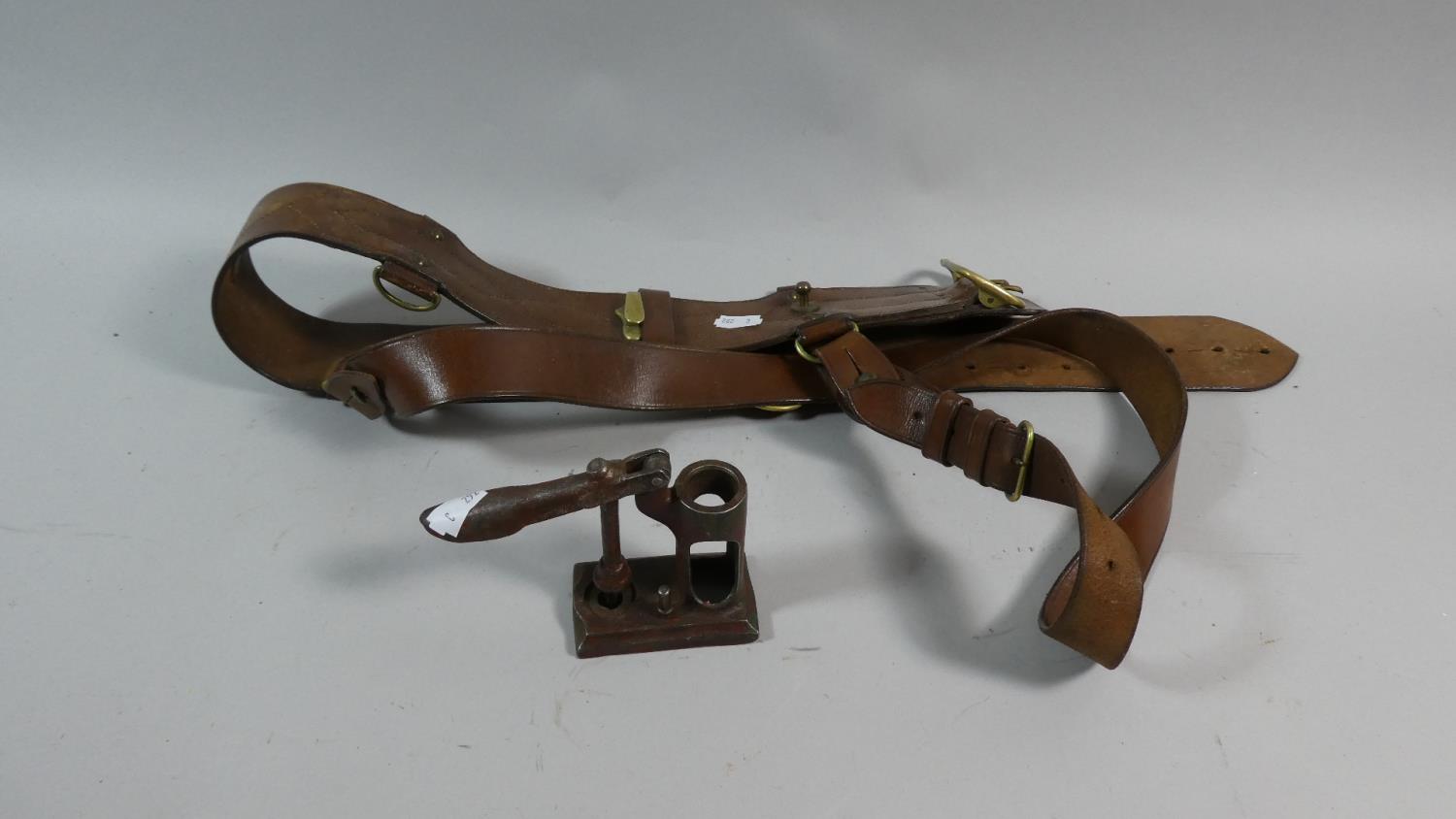 A Military Brass Mounted Leather Sam Brown and Shotgun Cartridge Maker