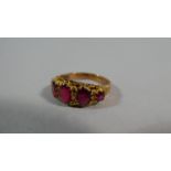 A 9ct Gold Dress Ring with Five Red Stones, 2.4g