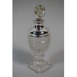 A Sterling Silver Topped Perfume Bottle with Glass Stopper, 14cm High