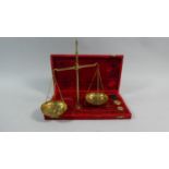 A Cased Set of Gold Scales and Weights