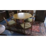 A Schrieber Circular Drop Leaf Dining Table and Six Matching Ladder Back Chairs