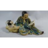 A Mid/late 20th Century Chinese Mudman Figure of Scholar in Recumbent Position at Study, 9.5cm High