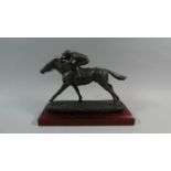 A Bronze Effect Resin Study of a Race Horse on Wooden Plinth, 31cm Long