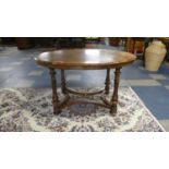 A Victorian Burr Walnut Oval Topped Occasional Table on Turned Reeded Supports with Shaped