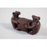 A Carved Wooden Okimono in the Form of Rats Carrying Box of Grain
