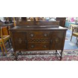 An Edwardian Oak Galleried Sideboard with Three Centre Drawers Flanked by Cupboards, 137cm Wide