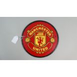 A Circular Reproduction Cast Metal Manchester United Football Plaque, 24cm Diameter, Plus VAT