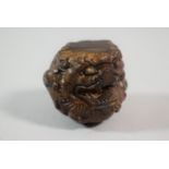 A Chinese Carved Wooden Ball in the Form of a Foo Dog Head, 4.5cm high