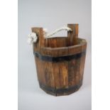 A Wooden Bucket with Metal Mounts and Rope Handle, 32cm high
