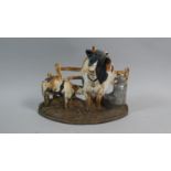 A Cast Metal Novelty Door Stop in the Form of a Cow and Calf by Gate with Churn, 29cm Wide