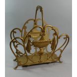 A Gilt Sprayed Metal Magazine Rack with Adam Style Vase Decoration, (AF) 42cm Wide