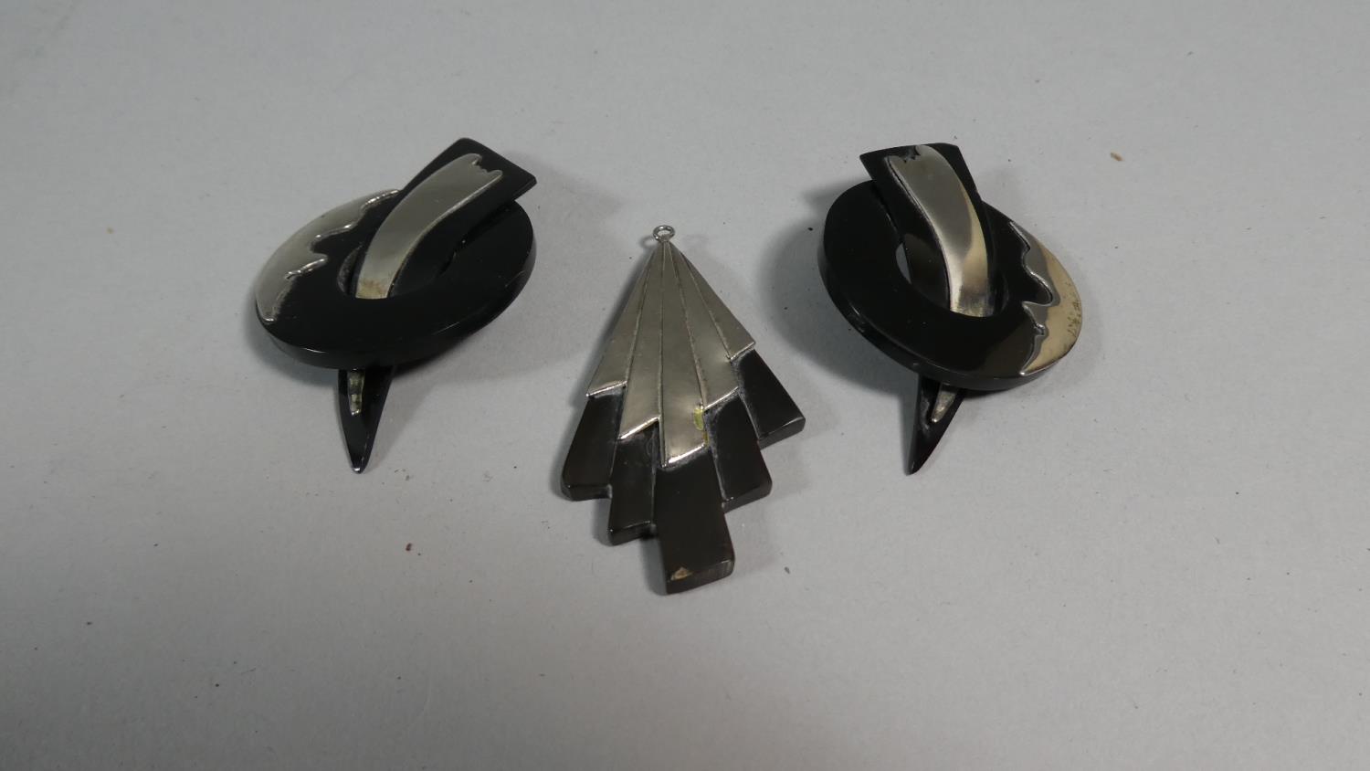 An Art Deco Horn and White Metal Earrings and Pendant Set