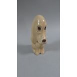 A Sylvac Seated Dog Ornament, 14cm high