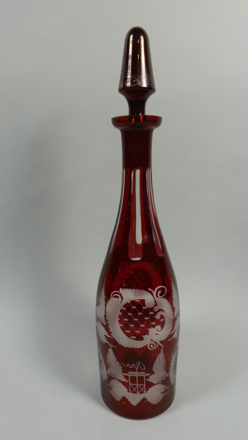 A Bohemian Overlaid Ruby Glass Decanter and Stopper, 39cm High