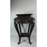 An Oriental Ebonised Vase Stand with Carved Decoration Depicting Carp in Reeds, Extended Cabriole