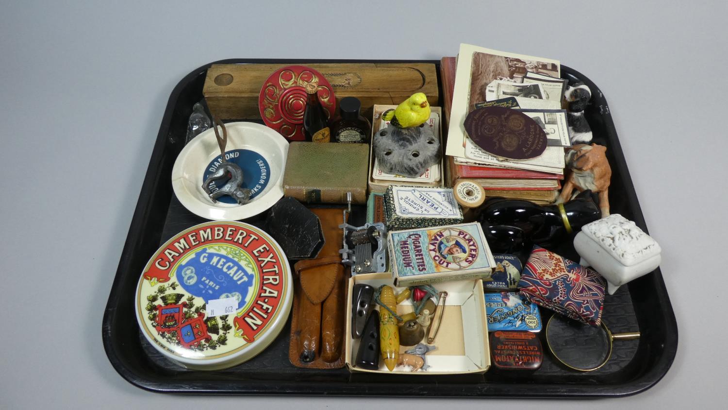 A Tray of Curios to Include Cigarette and Playing Cards, Advertising Ashtray, Pot Lid, Set of