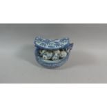 A Chinese Underglazed Blue and White Ceramic Opium Pillow in the form of a Dragon Boat With