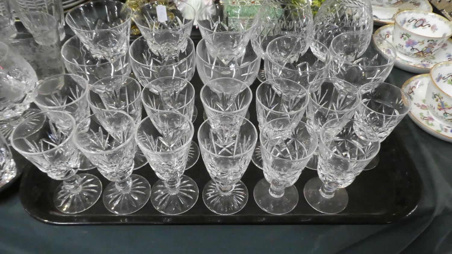 A Tray Containing Various Cut Glass Sherries and Wines