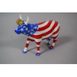 A Kansas City 2001 Cow Parade Holdings Corporation Ceramic Cow Decorated in American Flag, 12cm High