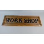 A Wooden Sign Painted 'Workshop', 76.5cm wide