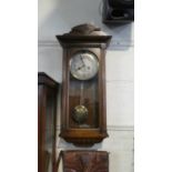 An Edwardian Oak Wall Clock, 75cm High