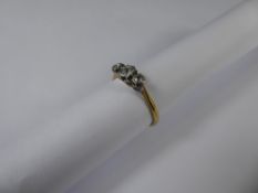 An 18ct Yellow Gold and Platinum Three Stone Rose Cut Diamond Ring, one 12 pts old cut diamond,