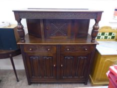 A Jacobean-Style Oak Buffet Cabinet, with carved front, legs and bulbous column supports. The