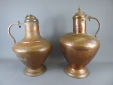 Two Antique Portuguese Copper Ewers, approx 44 cms and 55 cms respectively.