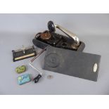 A Swiss Patent Exelda Portable Gramophone, with ultra-rapid needle sharpener and a quantity of