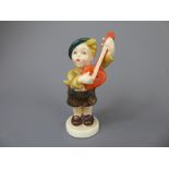 A 1950s Goebel Hummel Ceramic Prototype figurine of a boy playing a mandolin, stamped KF37 to
