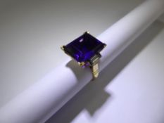 An 18ct Yellow Gold Russian Amethyst and Diamond Ring, the emerald cut royal purple amethyst