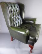 A Green Leather Elbow Chair.