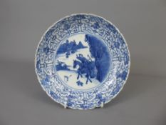 An Antique Chinese Blue and White Dish, an unusual scene of mounted figures hunting for rabbit,