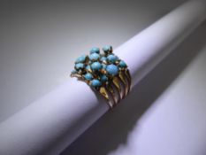 A 9 ct Yellow Gold and Turquoise 'Puzzle' Ring, size L+, approx 5.6 gms.