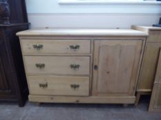 A Vintage Pine Chest of Drawers, with three graduated drawers flanked by a cupboard, approx 120 x 48