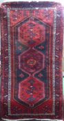 A Persian-Style Wool Carpet, geometric design, claret ground with cream and blue highlights,