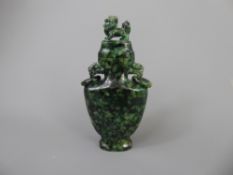 A Qinglong-style Spinach-Green Jade Vase and Cover, having lion-head handles with loose rings to