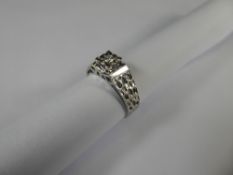 An 18ct White Gold Bark Finish Diamond Ring, the diamonds approx 5 pts, size L, approx 3.7 gms.