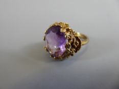 A 9ct Yellow Gold and Amethyst Ring, size H, approx 4.6 gms.