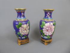 A Pair of Chinese Cloisonné Vases, blue ground with floral design, approx 16 cms.