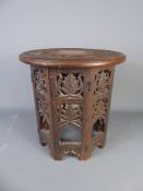A Moroccan Stool, with floral pierced decoration.
