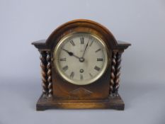 An Edwardian Oak Cased Mantel Clock, with blued hands, Edwards of Glasgow, with twin turned pillar