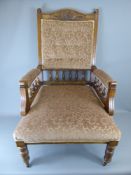 An American Edwardian Arm Chair, brown upholstery, turned spindle supports beneath the arm rest