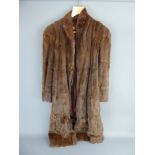 A Three-Quarter-Length Chestnut Mink Coat, medium size.