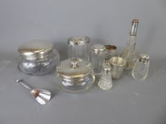 A Quantity of Silver-Topped Vanity Jars, including six bottles, a silver topped cotton-wool jar